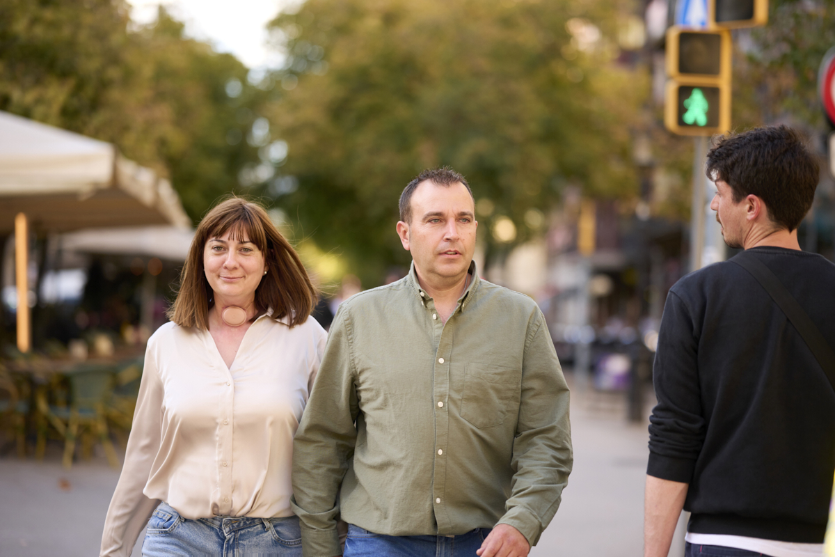 couple walking outside woman with HME